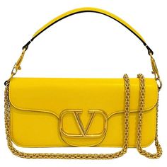 Valentino Garavani 'V' Logo Loco Shoulder Bag Bright yellow shoulder bag crafted in calfskin and designed with signature 'V' logo detail to the front. Featuring detachable top handle and gold chain strap. Magnetic closure leading to tonal leather interior with slip pocket. Rrp £2310 Size – Height 13cm, Width 27cm, Depth 6.5cm Condition – Very Good Composition – Calfskin Leather Comes with – Dust Bag Good Composition, Yellow Shoulder Bag, Leather Interior, Bright Yellow, Fashion Handbags, Chain Strap, Valentino Garavani, Gold Chain, Top Handle