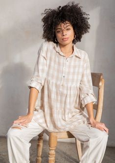 Just in time for Spring, our best-selling lightweight tunic top is back in a classic retro gingham check. Featuring a rolled long sleeve with button tab closure, a roomy tiered body for extra movement and flow, and a button-up front. A versatile cotton-blend top that pairs effortlessly with denim. FINAL SALE Large gingham check Relaxed fit Rolled sleeve with button tab closure Long tunic length Tiered body Collared neckline Button front Popover style Resort top Model is 5'8, wearing a size S in Oversized Plaid Blouse For Spring, Casual Gingham Blouse For Daywear, Gingham Long Sleeve Blouse For Day Out, Long Sleeve Gingham Blouse For Day Out, Casual Gingham Blouse For Fall, Spring Gingham Button-up Blouse, Spring Button-up Gingham Blouse, Long Tunic, Gingham Check