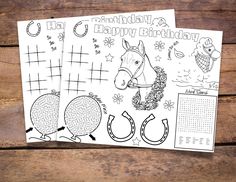 two happy birthday coloring pages sitting on top of a wooden table next to each other