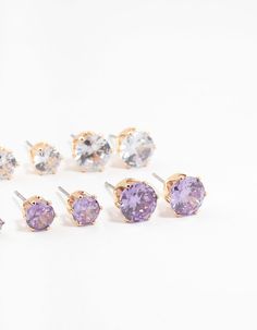 Polish off your look with this sparkling 6-pack of gold-toned stud earrings featuring a captivating blend of silver and purple cubic zirconia gems. Wear them solo for a sophisticated accent or layer them for a dazzling display. Material: Cubic Zirconia Color: Silver & Purple Dimensions: Length 8 mm x Width 9 mm Smallest Earring Length 3 mm x Smallest Earring Width 4 mm | Lovisa Gold Round Silver & Purple Cubic Zirconia Stud Earrings 6-Pack Small Earrings, 6 Packs, 6 Pack, Cubic Zirconia, Gems, Sparkle, Stud Earrings, Purple, Silver