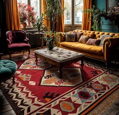 a living room with couches, chairs and rugs in front of large windows