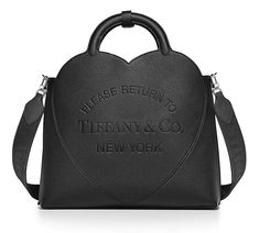 Inspired by one of the House’s most distinctive designs, the heart-shaped Return to Tiffany® handbags are crafted in supple leather. Add a playful touch to every day with the generously sized medium tote embossed with the signature heart motif. It’s designed with a detachable woven strap and an interior, removable leather pouch to keep your essentials close. Size: Medium Measurements: Length: 14.5" Width: 5.5" Height: 16.9" Strap drop: 13.5" Handle drop: 4.5" Material: Taurillon leather Made in Italy Condition: New with box + dust bag + care card. Please refer to pictures. SKU: 12151732AL _______________________________________________ ALL SALES ARE FINAL! Bellissima Consignment Boutique is a brick-and-mortar store, open since 1998 with an impeccable reputation located in SoCal. Most items Tiffany Bag, Iconic Jewelry, Return To Tiffany, Medium Tote Bag, Consignment Boutique, Heart Motif, Mini Tote Bag, Medium Tote, Tote Bag Leather