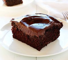 a piece of chocolate cake on a white plate