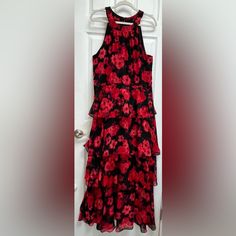 Beautiful Black And Red Floral Design Dress With An Invisible Back Zipper And Hook And Eye Closure At The Neck. Soft Tiers Of Floral Fabric Are Lined With Black. The Bottom Tier Is Not Lined. Very Flattering Fit. Pit To Pit Measures 19 1/2 Inches. Nwt. Non-Smoking Home Red Floral Print Elegant Sleeveless Dress, Red Fitted Sleeveless Dress With Floral Print, Red Floral Print Fitted Sleeveless Dress, Fitted Red Floral Sleeveless Dress, Red Floral Print Halter Neck Sleeveless Dress, Red Halter Neck Sleeveless Dress With Floral Print, Red Floral Halter Neck Sleeveless Dress, Printed Beach Dresses, Floral Dress Design