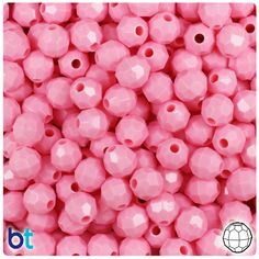 pink plastic beads with holes in the middle