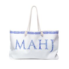 a large white bag with the word mahj printed in blue letters on it