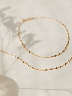 Light up your bracelet stack with a glowing string of solid gold: a high-shine staple you can put on…and leave on forever. Available in an adjustable 6.25-7.25" length or a custom length to fit any wrist! 10k solid gold is:- more durable and scratch-resistant than 14k- made for a lifetime of 24/7 wear- nearly indistinguishable from 14k in color and shine- able to be polished and refinished indefinitely- waterproof and sweat-proof—just no chemicals, please! We even wrote a journal about why 10k i Adjustable 14k Gold Bracelet, Tarnish Resistant, Adjustable Classic 14k Gold-filled Bracelet, Minimalist Single Strand Gold Bracelet, Classic Adjustable 14k Gold Filled Bracelet, Dainty Adjustable 14k Gold Paperclip Bracelet, Adjustable 14k Gold-filled Paperclip Bracelet With Delicate Chain, Adjustable 14k Gold Delicate Chain Bracelet, Delicate Gold Single Strand Bracelet, Delicate Single Strand Gold Bracelet