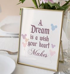 a sign that says a dream is a wish your heart makes with balloons and hearts