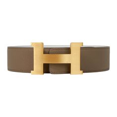 Guaranteed authentic Hermes Constance 42 mm belt featured in reversible Etoupe to White Epsom leather. Fabulous over sized brushed gold signature H buckle. The 42 mm now a retired size, this is sure to become a collectors treasure. Signature HERMES PARIS MADE IN FRANCE is stamped on the belt. NEW or NEVER WORN. final saleSIZE:105 cmCONDITION:NEW or NEVER WORN Hermes Belt Mens, Hermes Belt, Hermes Constance, Hermes Paris, Over Sized, Made In France, Buckle, Paris, France