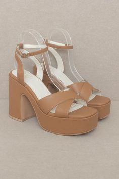 This gorgeous chunky sandal is bringing all the 70's glam. The Norah features a cross strap front and a sweet ankle buckle detail. Heel Height: 4.25" The front platform: 1.5" Types of closures: Slip on/ Buckle Material: Faux leather Imported Brown Chunky Platform Sandals For Party, Chic Brown Chunky Platform Sandals, Brown Cross Strap Heels For Summer, Chic Platform Sandals With Cross Strap, Chic Cross Strap Platform Sandals, Summer Platform Heels With Cross Strap, Spring Platform Heels With Cross Strap, 70s Glam, Farm Clothes