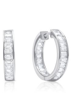 Hand-set baguette stones create a dazzling effect on these platinum-plated hoop earrings. 1/4" diameter Hypoallergenic Total stone weight: 4.0ct. Sterling silver/platinum plate/cubic zirconia Imported Classic Huggie Earrings With Baguette Cut Prong Setting, Silver Emerald Cut Diamond Earrings With Baguettes, Silver Emerald-cut Baguette Diamond Earrings, Classic Hoop Earrings With Baguette Diamonds, Silver Hoop Diamond Earrings With Baguette Diamonds, Silver Baguette Diamond Hoop Earrings, Formal Baguette Cut Cubic Zirconia Huggie Earrings, Classic Silver Hoop Earrings With Baguette Diamonds, Classic Silver Baguette-cut Hoop Earrings