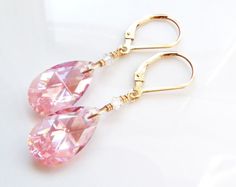 Pink crystal dangle earrings features flattering teardrop shaped Swarovski crystals in a medium pink hue called rose. A sparkly and thoughtful pair dangle earrings for a woman born in October since pink opal is one of her birthstones. Earrings Details: - Choose sterling silver or 14k gold filled - Customize earring closures: leverbacks (shown - clasps on the back), earring wires (like hooks), or dangles off earring posts - Length: 1.50 inches (3.81 cm) long including earring closures shown\ - Sw Elegant Pink Crystal Drop Earrings, Pink Teardrop Earrings For Anniversary, Elegant Pink Teardrop Earrings, Pink Crystal Earrings For Formal Occasions, Pink Teardrop Crystal Earrings, Pink Elegant Teardrop Earrings For Anniversary, Pink Drop Crystal Earrings For Party, Elegant Pink Teardrop Earrings For Anniversary, Pink Teardrop Earrings For Formal Occasions