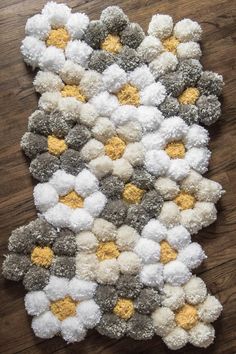 the easy way to make a handmade pom - pom rug