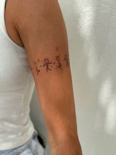 a woman with a tattoo on her arm