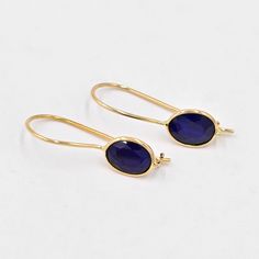 Natural Sapphire Earrings (Pair) ✪Gemstone: Natural Sapphire  ✪Metal: 18k solid Yellow gold. ✪Stone size: 6x8 mm. ✪Stone Shape : Oval  ✪Stone Weight : 2.85 Ct. ✪ Earring Weight : 1.40 Gram ✪Earring Length : 25 mm. ✪Earring width : 7 mm. ✪Setting type: Bezel wire setting. If you need any other preferred stone please contact us. Sapphire benefits - *The result is a good gain of self-confidence and mental balance.         Surprisingly, blue Sapphire also has some health benefits.  *Wearing the Neelam/Blue Sapphire aids in digestion too.  *Having a direct impact on wealth, the Blue Sapphire (Neelam)stone can         cause a boost in finances. QUALITY OF MATERIALS: Metal: Most of our jewelry at JewelryMansion is made with precious metals like gold and silver. These metals are 100% non-allergic 14k Gold Sapphire Gemstone Earrings, Gold Sapphire Dangle Earrings, Sapphire Gemstone Drop Earrings, Gold Sapphire Drop Earrings, Teardrop Sapphire Earrings For Gift, Sapphire Briolette Gemstone Earrings, Yellow Gold Sapphire Earrings For Pierced Ears, Faceted Yellow Gold Oval Earrings, Yellow Gold Faceted Oval Earrings