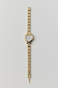 Linked chain watch watch topped with a heart-shaped case we love. Content + Care Mixed metal, glass Wipe clean Imported | Heart Linked Watch in Gold, Women's at Urban Outfitters Gold Watch Aesthetic, Christmas List Ideas For Women, Urban Outfitters Aesthetic, Heart Shaped Watch, L Heart, Jewelry 2024, Chain Watch, Heart Watch, Pinterest Contest