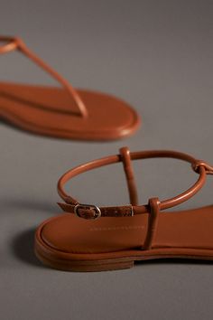 Leather upper, insole, sole Buckle styling Imported | T-Strap Sandals by Anthropologie in Brown, Women's, Size: 37, Leather T Strap Sandals Outfit, Flat Adjustable Strap Slingback Sandals, Flat T-strap Sandals With Buckle Closure, Adjustable Flat T-strap Sandals With Buckle Closure, Adjustable Flat Slingback Sandals With Strap, Adjustable Strap Flat Slingback Sandals, Adjustable Flat Slingback Sandals, Chic Adjustable T-strap Slingback Sandals, Chic Adjustable T-strap Sandals With Removable Insole