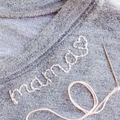 a close up of a sweater with the word love spelled on it