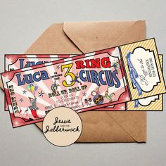 two circus tickets sitting on top of an envelope