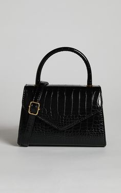 Marilou Bag - Croc Embossed Top Handle Bag in Black | Showpo USA Trapezoid Shape, Synthetic Materials, Handle Bag, Emboss, Snap Button, Top Handle, Adjustable Straps, Bag Accessories, Top Handle Bag