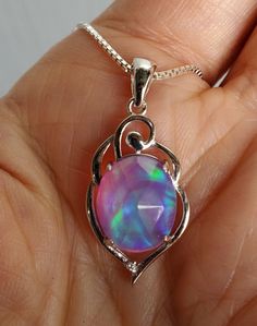 Gorgeous Colorful Rainbow Aurora Opal Necklace, 10x12mm Lab Created Rose Cut Synthetic Opal, See Video For Example Of Color And Quality Of Available Gems. Gems Vary Slightly, But Color Scheme And Quality Does Not. 925 Sterling Silver Swirl Top Pendant, Rhodium Plated. 18" Sterling Silver Chain. Gift Box Included. Aurora Opal, Halo Necklace, Rainbow Opal, Synthetic Opal, Colorful Rainbow, Opal Necklace, Sterling Silver Chain, Rose Cut, Sterling Silver Chains