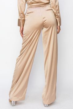 • SKU: P-2140• S-M-L• Hand wash onlyDiscover our Long High-Waist Pants, expertly crafted from premium polyester fabric for a sleek and stylish addition to your wardrobe. These versatile pants feature a flattering high-waisted silhouette that provides both comfort and support, making them the perfect choice for any occasion. Crafted from premium materials, these pants are soft, gentle on your skin, and perfect for any occasion, effortlessly transitioning from day to night. Fitted Solid Color Trousers, Fitted Straight Pants In Solid Color, Elegant Solid Color Pants For Night Out, Solid Color Wide Leg Pants For Night Out, Elegant High-waisted Satin Bottoms, Solid Satin Pants With Elastic Waistband, Elegant Satin Pants For Fall, Sleek Satin Pants, Chic Full-length Satin Bottoms