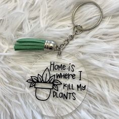 a keychain that says, home is where i fill my plants on it