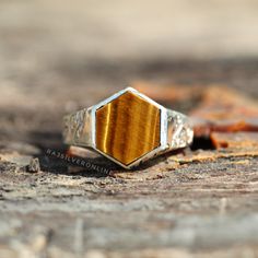 Tiger's Eye Ring, Hexagon Ring, 925 Sterling Silver Ring, 'Until The End' Ring, Handmade Ring, Silver Ring, Friendship Ring, Men/Women Ring Engraving on Ring : Until The End Metal: 925 Sterling Silver Gemstone : Tiger's Eye Stone Color : Yellow Stone Shape : Hexagon Stone Setting: Bezel Benefits of Tiger's eye:- In the home space and balancing Feng Shui vibes, the Tiger's Eye gemstone is also known for keeping moods grounded, attracting good luck, and dispelling fears Benefits of wearing silver: Silver Hexagon Sterling Silver Ring, Silver Sterling Silver Octagon Ring, Sterling Silver Hexagon Ring In Silver, Sterling Silver Ring In Octagon Shape, Sterling Silver Octagon Promise Ring, Octagon Sterling Silver Ring With Polished Finish, Silver Octagon Signet Ring As Gift, Sterling Silver Octagon Ring, Ring Hexagon