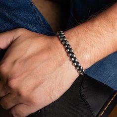 This bracelet features a tightly woven hand braided band with alternating genuine leather and .925 sterling silver handmade beads. The rich texture draws the eye, creating a unique, substantial, and intriguing braided leather bracelet that complements any outfit. Finished with a hook clasp that provides both - convenince and security. Perfect for the minimalist at heart, who likes just the right elevated touch. It can be worn as a stand-alone bracelet or stacked.SHOW YOUR FOREVER LOVE - A piece Classic Adjustable Beaded Bracelets With Silver Beads, Adjustable Sterling Silver Bracelet With Stainless Steel Clasp, Modern Braided Jewelry For Everyday, Classic Hand-strung Sterling Silver Bracelets, Adjustable Braided Sterling Silver Bracelet, Black Bracelets With Sterling Silver Clasp, Classic Black Braided Jewelry, Modern Adjustable Bracelets With Oxidized Finish, Adjustable Silver Braided Bracelet With Stainless Steel Clasp