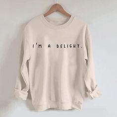 I'm A Delight Sweatshirt,Graphic Sweatshirt,Woman's Sweatshirt,Gift For Woman,Gift For Her,Birthday Gift,Funny Sweater,Anti Social Crewneck Welcome to Bee Design Gifts If you are looking for soft, comfy, first-rate sweatshirts, you're in the right place! I love what I do and strive to make your shopping experience just right for you. If you have any questions, concerns or comments about my products, feel free to send a message anytime. ⭐ 50% cotton, 50% polyester ⭐ Pre-shrunk ⭐Classic fit ⭐ 1x1 athletic rib knit collar with spandex ⭐ Air-jet spun yarn with a soft feel and reduced pilling ⭐Double-needle stitched collar, shoulders, armholes, cuffs, and hem HOW TO PLACE ORDER 1. Check photos for size chart, model comparison and color options 2. Select size and color from the drop down options Funny Letter Print Sweater With Crew Neck, Funny Letter Print Crew Neck Sweater, White Long Sleeve Sweatshirt With Funny Text, Long Sleeve Slogan Tops As Gifts, Crew Neck Slogan Sweatshirt As Gift, Funny Sweater, Sweatshirt Graphic, Funny Sweaters, Sweatshirt Style