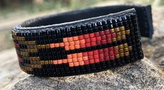 Beaded Bracelet in Reds and Golds on a Black Background | Etsy Hat Bands, Native American Beadwork, Pretty Bracelets, Hat Band, Loom Beading, Red And Gold, Shades Of Red, Bracelet Designs, Geometric Design