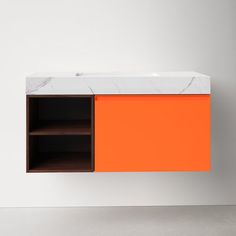 an orange cabinet with marble top and shelves