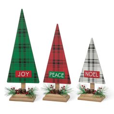 three wooden christmas trees with joy, peace and noel written on the tops in plaid