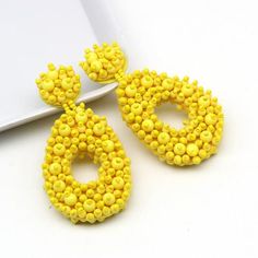 Size:Drop Length: 3 inchWidth: 1.5 inchColor: yellowTrendy Women Statement Earrings Boho Ethnic Dangle Drop Earrings Yellow Resin Beads Jewelry Wedding.These earrings are perfect for gift giving. These earrings will come in Gift Box.All items are handmade and shipped promptly. Please allow extra time when ordering multiple items. Comfortable beads spacers. For a special occasion and just for every day! Cheap Yellow Bohemian Beaded Earrings, Seed Beaded Earrings, Yellow Resin, Bridal Party Jewelry, Arrow Pendant, Earrings Trendy, Yellow Earrings, Green Quartz, Resin Beads