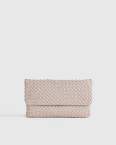 Italian Leather Handwoven Convertible Clutch Everyday Woven Leather Clutch, Luxury Intrecciato Weave Clutch For Travel, Intrecciato Weave Clutch Pouch For Travel, Luxury Woven Leather Rectangular Clutch, Chic Woven Leather Clutch For Everyday Use, Luxury Rectangular Woven Leather Clutch, Chic Everyday Woven Leather Clutch, Modern Leather Clutch With Intrecciato Weave, Chic Pouch Clutch With Intrecciato Weave