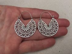 "These are so chic and cool! Stylish and versatile mandala hoop earrings. They have incredible detail and design with all the cut outs. Versatile and perfect for everyday wear. The earrings measure 1 3/4\" long by 1 3/8\" wide. Made from allergy free plated silver. Thanks for stopping by! Please take a moment and visit the rest of my Etsy shop. I have many more unique jewelry designs to choose from! 🌸 Tiger Flower Jewelry 🌸 🌸 Inspired by Nature 🌸" Bohemian Small Hoop Earrings Pierced, Small Hoop Earrings For Festival, Bohemian Small Hoop Pierced Earrings, Bohemian Hoop Plug Earrings For Festivals, Handmade Hoop Plug Earrings For Festivals, Bohemian Hoop Plug Earrings For Pierced Ears, Nickel Free Hoop Earrings For Festival, Bohemian Small Hoop Earrings With Intricate Design, Unique Small Hoop Earrings For Festivals