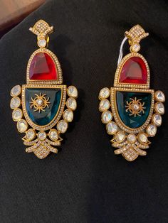 Earrings perfect for festive wear Formal Multicolor Clip-on Earrings, Designer Red Earrings For Formal Occasions, Party Chandbali Plug Earrings, Chandbali Plug Earrings For Party, Elegant Red Hoop Earrings For Formal Occasions, Designer Multicolor Jewelry For Party, Elegant Red Single Clip-on Earring, Elegant Christmas Celebration Earrings, Traditional Gold Clip-on Earrings For Party