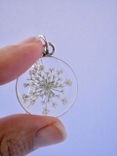 "Our Arrowhead Frame has a modern bohemian feel and is available in a variety of real preserved botanicals. Choose from 24k gold plated or .999 sterling silver plated. The Dandelion Seed symbolizes wishes. The Fern is a symbol of sincerity Forget-me-nots are known as a symbol of lasting friendship, love, and remembrance Lavender is a symbol of devotion Pendant hangs from a gold or silver plated chain, available in 26\" or 30\" lengths. Choose from plain chain or satellite chain, see picture for Minimalist Nickel-free Flower Pendant Jewelry, Delicate Flower Birth Flower Jewelry, Nature-inspired Flower Charm Round Pendant Necklace, Botanical Pressed Flower Wedding Jewelry, Delicate Small Jewelry Gift, Unique Flower Pendant Necklaces With Charm, Delicate Jewelry For Gifts, Botanical Flower Wedding Jewelry, Botanical Flower Jewelry With Natural Inclusions