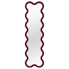 a long mirror with wavy lines on the bottom and sides, hanging from a wall