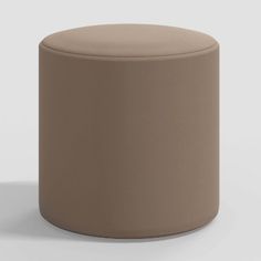 a small round stool with a light brown cover on the top and bottom, sitting in front of a white background