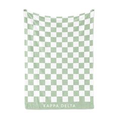 a green and white checkered towel with the words, alpha chiomega on it