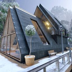 an unusual house is shown in the snow