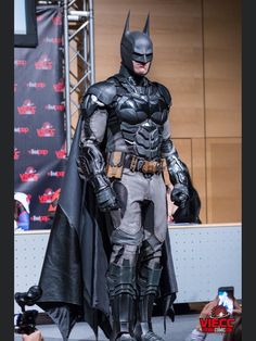 a man dressed as batman standing on stage