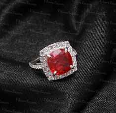 Main Stone - Natural Ruby Gemstone  Main Stone Size - 10 mm Cushion Cut  Carat Weight - 5 Ct. + Secondary Stone - Synthetic American Diamonds Metal - 22 Carat White Rhodium plating over 925 Sterling Silver Ruby is the July  birthstone. Dispatch Time - 1 to 3 days Deliver Time - 11-23 working days PayPal - We accept only PayPal payment method. Return Policy- 30 Days Return policy ( Item Damaged/Not in proper Size/Incorrect Item Send ) We always believe in customer satisfaction, we request you to please mark a message us for any concern before escalate it to Etsy, we always try to solve it ASAP. July Birthstone Ring, Red Band, July Birthstone, American Diamond, Ring Promise, Ruby Gemstone, Red Ruby, Ruby Ring, Natural Ruby