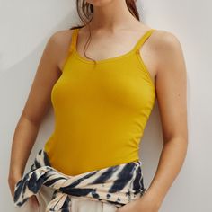 Anthropologie Seamless Layering Cami, Gold In Color, New With Tags, Sizes M And L. Polyamide And Elastane 20” L Machine Wash Yellow Tank Top With Built-in Bra For Summer, Yellow Tank Top With Built-in Bra For Spring, Casual Summer Camisole With Seamless Construction, Casual Solid Camisole With Seamless Construction, Casual Solid Seamless Camisole, Casual Seamless Summer Camisole, Seamless Casual Camisole, Yellow Stretch Top With Built-in Bra, Basic Bra-friendly Camisole For Summer