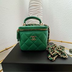 100% Authentic Chanel Bag. Very Good Condition. Very Attractive Green. Mini Makeup Bag. New Model With A Chip. Comes With A Mirror, Very Delicate. Gold Hardware Chain. Can Be Worn Crossbody Or Handheld. Nearly Brand New. Comes With A Dust Bag And Box. Size: W 11 X H 9.5 X D 7 Cm High-end Box Bag With Gold-tone Hardware, High-end Gold-tone Pouch Box Bag, High-end Everyday Luxury Crossbody Bag, High-end Pouch Evening Bag With Dust Bag, Luxury Pouch Box Bag With Detachable Handle, High-end Travel Clutch Box Bag, High-end Pouch Bag For Gift, Luxury Handheld Shoulder Bag With Original Box, Luxury Square Box Bag For Travel