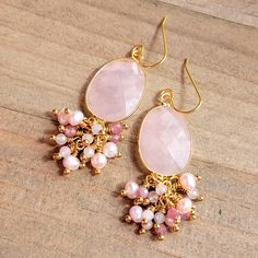 These beauties will adorn your ears with great elegance. Faceted rose quartz Facet pink Tourmaline gemstones Faceted pale blue Morganite gemstones Pink freshwater pearls 10k gold plate ear hooks 18k gold plate wire Length 2.5" Made in the USA Pink Gemstone Accented Earrings For Weddings, Pink Gemstone Earrings For Wedding, Pink Gemstone Wedding Earrings, Pink Wedding Earrings With Gemstone Accents, Pink Drop Earrings With Gemstone Accents, Elegant Rose Quartz Jewelry With Natural Stones, Elegant Wedding Earrings With Gemstone Beads, Pink Gemstone Accents Earrings For Gifts, Pink Gemstone Accented Earrings For Gift