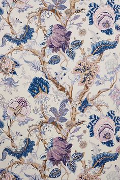 a blue and pink floral wallpaper with lots of different flowers on it's side