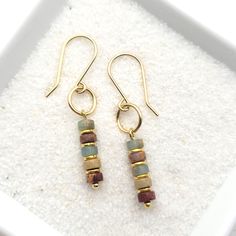 "Minimalist style with these 14k gold filled earrings with Aqua Terra jasper beads * Earrings are made from quality 14k gold filled wire, they measure approximately 1.5\" in length.   * Polished to a high shine * Sent in a Gift Box with Polishing Cloth * Handmade in Montana ----- OUR MATERIALS -----  *STERLING SILVER - Experience the elegance of Sterling Silver, a metal that combines versatility with a sophisticated look. This durable and lightweight alloy is perfect for everyday wear, offering Homemade Earrings, Gold Bead Earrings, Aqua Terra, Western Earrings, Gold Dangle Earrings, Earrings Inspiration, Homemade Jewelry, Gold Filled Earrings, Jasper Beads