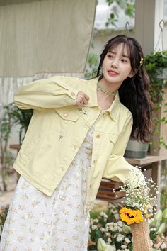 Fun light yellow denim jacket with embroidered daisies flying around. Regular low waist/hip length with side pockets and faux chest pocket flaps. S: 21.5" across shoulders, 45" chest, 20" lengthM: 22" across shoulders, 46.5" chest, 20.5" lengthL: 22.5" across shoulders, 48" chest, 21" length Spring Cotton Denim Jacket With Long Sleeves, Spring Long Sleeve Cotton Denim Jacket, Yellow Spring Outerwear With Pockets, Spring Yellow Outerwear With Pockets, Casual Yellow Spring Outerwear, Casual Yellow Outerwear For Spring, Yellow Denim Jacket With Pockets For Fall, Yellow Cotton Denim Jacket With Pockets, Yellow Long Sleeve Denim Jacket